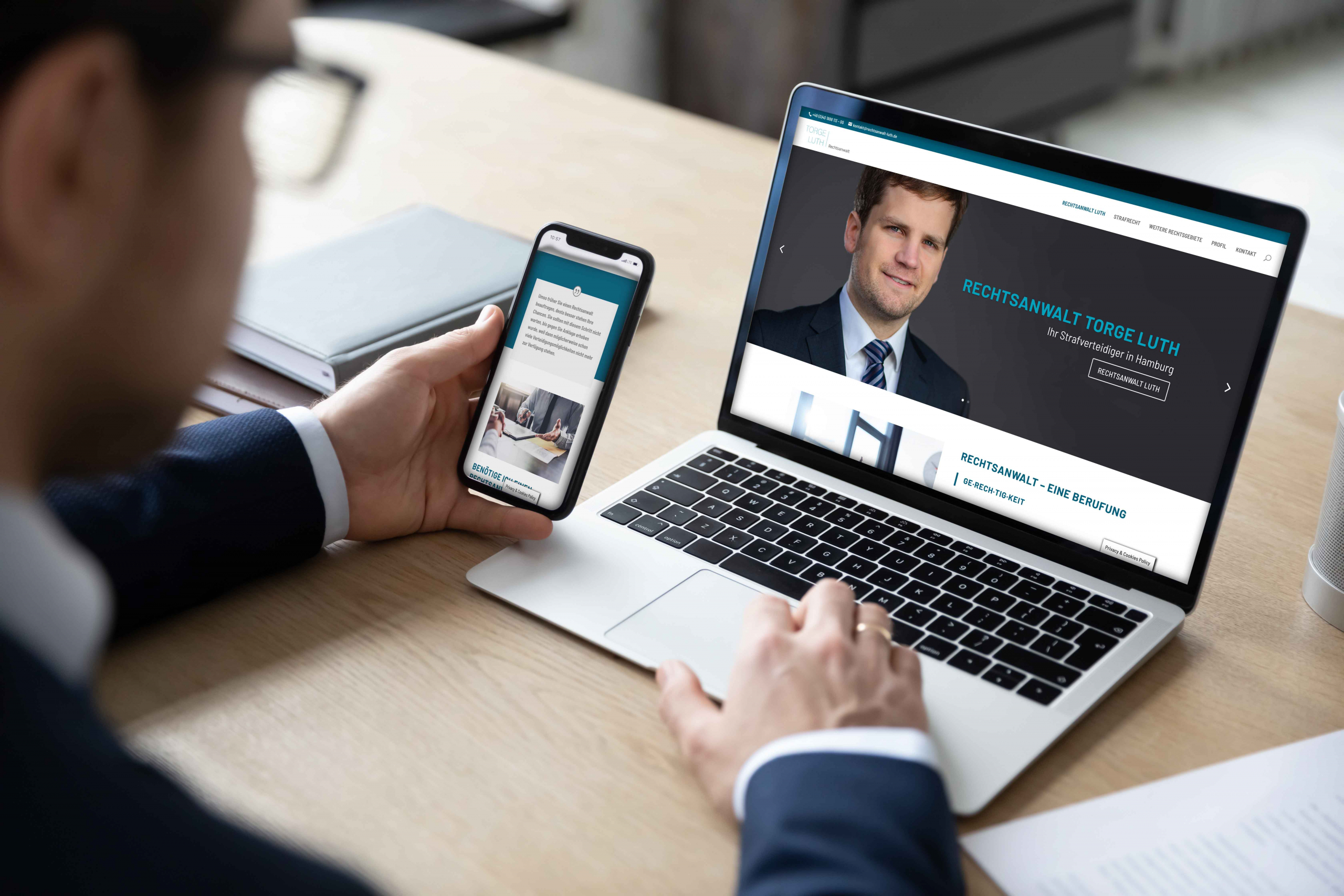 Back view of male employer work on laptop and cellphone